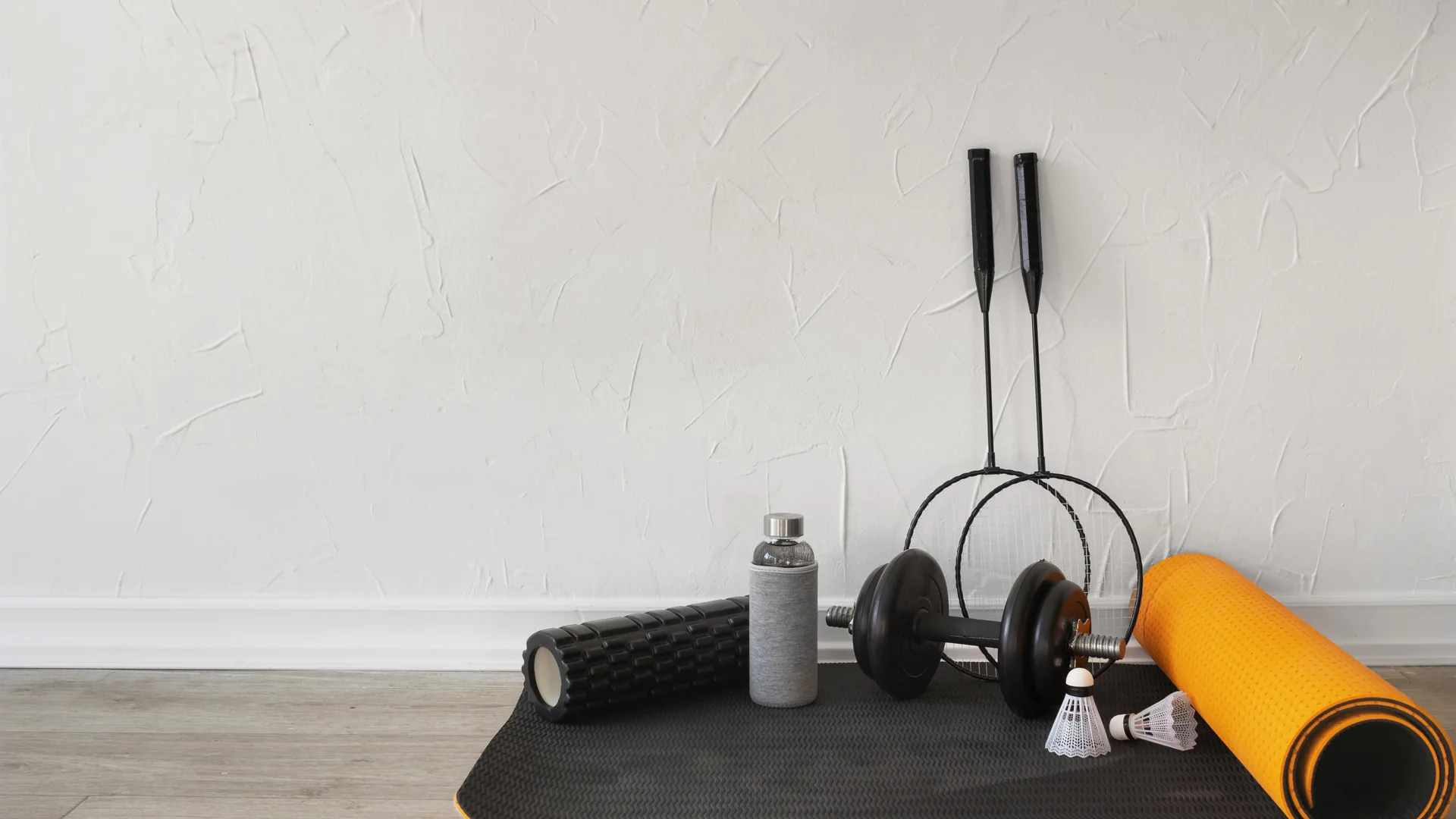 Yoga mat with dumbbells and workout gear